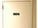 White storage door with black label providing secure storage options within the unit at 690 Island Way # 707, Clearwater Beach, FL 33767
