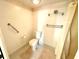 Toilet room featuring grab bar and glass shelving at 690 Island Way # 707, Clearwater Beach, FL 33767