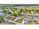 Neighborhood aerial view showcases single Gathering homes with mature trees, long driveways and community highway access at 7041 Lexington Cir, Brooksville, FL 34602