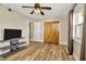 Well-lit bedroom with closet and a modern ceiling fan fixture at 7041 Lexington Cir, Brooksville, FL 34602