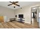 Spacious bedroom with sleek ceiling fan and wood-look flooring at 7041 Lexington Cir, Brooksville, FL 34602