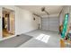 Garage features epoxy floors, access to the home, storage, and a garage door at 7041 Lexington Cir, Brooksville, FL 34602