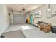 Spacious garage with gray epoxy flooring and an insulated garage door offers plenty of storage and workspace at 7041 Lexington Cir, Brooksville, FL 34602