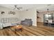 Open-concept living room featuring stylish decor and wood-look flooring at 7041 Lexington Cir, Brooksville, FL 34602