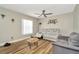 Comfortable living room with new wood-look flooring and large window at 7041 Lexington Cir, Brooksville, FL 34602