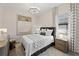 Modern bedroom with sleek furnishings, soft lighting, and contemporary decor for a relaxing retreat at 8118 Thruso Rd, Port Charlotte, FL 33981