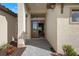 Elegant entryway with a stylish front door, stone walkway, and manicured landscaping at 8118 Thruso Rd, Port Charlotte, FL 33981