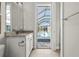 Bathroom with pool view, featuring a granite countertop and bright lighting at 8580 Ivy Stark Blvd, Wesley Chapel, FL 33545