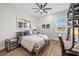 Stylish bedroom with natural light, a unique work-study space and comfortable bed at 8580 Ivy Stark Blvd, Wesley Chapel, FL 33545