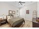 Cozy bedroom with queen bed, side tables, ample closet space, and warm natural light at 8580 Ivy Stark Blvd, Wesley Chapel, FL 33545
