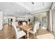 Open concept dining room with modern lighting, and access to the outside at 8580 Ivy Stark Blvd, Wesley Chapel, FL 33545
