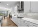 Modern kitchen with stainless steel appliances, white cabinets and quartz countertops at 8580 Ivy Stark Blvd, Wesley Chapel, FL 33545