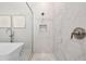 Modern glass shower with white marble tiles, mosaic accent, and a convenient shower niche at 8580 Ivy Stark Blvd, Wesley Chapel, FL 33545