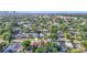 Aerial view of neighborhood featuring tree-lined streets and city skyline in background at 917 W Alfred St, Tampa, FL 33603