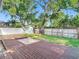 Large backyard featuring a deck and mature trees providing shade plus a storage shed at 917 W Alfred St, Tampa, FL 33603