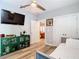 Bedroom featuring a TV, doorway to another room, and storage at 917 W Alfred St, Tampa, FL 33603