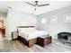 Cozy bedroom with wood floors, neutral walls, and natural light streaming through the windows at 917 W Alfred St, Tampa, FL 33603