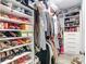 Organized walk-in closet with ample shelving for shoes and hanging space for clothes at 917 W Alfred St, Tampa, FL 33603