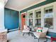 Inviting front porch featuring comfortable seating and stylish decor at 917 W Alfred St, Tampa, FL 33603