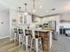Modern kitchen featuring a brick island with barstool seating, stainless steel appliances, and ample cabinet space at 917 W Alfred St, Tampa, FL 33603