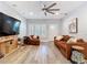 Cozy living room with wood floors, shuttered windows, a comfortable sitting area and a view of the front door at 917 W Alfred St, Tampa, FL 33603
