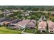An aerial view of a residential community with mature trees and a community pool with green space at 935 Terra Vista St, Brandon, FL 33511