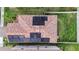 Top-down view of a home with solar panels, a brick driveway and well-maintained lawn at 935 Terra Vista St, Brandon, FL 33511