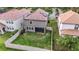 Aerial view of fenced backyard featuring a well-maintained lawn and mature trees at 935 Terra Vista St, Brandon, FL 33511