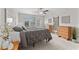 This bedroom includes a ceiling fan, natural light from the windows, and modern decor at 935 Terra Vista St, Brandon, FL 33511