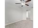 A neutral-toned bedroom featuring a ceiling fan and soft carpet, offering a calm retreat at 935 Terra Vista St, Brandon, FL 33511