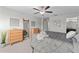 This bedroom includes a ceiling fan, natural light from the windows, and modern decor at 935 Terra Vista St, Brandon, FL 33511