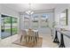 Bright dining area with a sliding glass door to patio and backyard providing lots of natural light at 935 Terra Vista St, Brandon, FL 33511