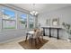 Inviting dining room with natural light with a modern chandelier and neutral color palette at 935 Terra Vista St, Brandon, FL 33511