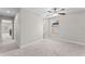 Upper hallway with neutral walls, carpet, ceiling fan and natural light from the window, leading to bedrooms at 935 Terra Vista St, Brandon, FL 33511