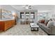 Spacious living room with a ceiling fan, area rug, and large windows at 935 Terra Vista St, Brandon, FL 33511