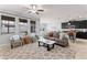 Open-concept living area featuring lots of light, modern furnishings, and tile flooring at 935 Terra Vista St, Brandon, FL 33511