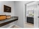 Stylish powder room with granite countertop and decorative accents at 935 Terra Vista St, Brandon, FL 33511