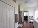 Bright bathroom showcasing dual vanity, walk-in shower, and access to the office at 10118 Cleghorn Dr, San Antonio, FL 33576