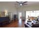 Open living room with a piano and adjacent sunroom at 10118 Cleghorn Dr, San Antonio, FL 33576