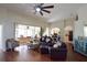 Spacious living room with hardwood floors and plenty of natural light at 10118 Cleghorn Dr, San Antonio, FL 33576