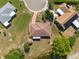 Aerial view showcases the home's backyard pond and landscaping, emphasizing outdoor living and privacy at 103 El Turco Ct, Sun City Center, FL 33573