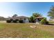 Spacious backyard featuring a small pond and enclosed gazebo at 103 El Turco Ct, Sun City Center, FL 33573