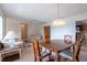Inviting living area adjacent to the dining room with views of the kitchen at 103 El Turco Ct, Sun City Center, FL 33573