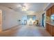 Open-concept living space featuring neutral tones and views to the kitchen area at 103 El Turco Ct, Sun City Center, FL 33573