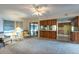 Cozy living room with a view of the kitchen and access to the screened patio at 103 El Turco Ct, Sun City Center, FL 33573