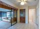 Bright sunroom featuring sliding glass doors, tiled floor, and a comfortable seating area for relaxation at 103 El Turco Ct, Sun City Center, FL 33573