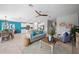Open-concept living space with modern furniture, dining area, and a view of the kitchen, perfect for entertaining at 107 Leisure Pl, Rotonda West, FL 33947