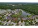 Aerial view of the neighborhood with homes nestled among scenic lakes and greenery at 10734 Breaking Rocks Dr, Tampa, FL 33647