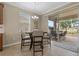 Breakfast nook with seating and view of the screened in patio at 10734 Breaking Rocks Dr, Tampa, FL 33647
