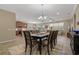 Open concept dining room with views of the living room and kitchen at 10734 Breaking Rocks Dr, Tampa, FL 33647